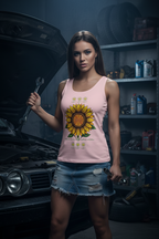 Woman in a garage wearing a pink tank top with a sunflower design.