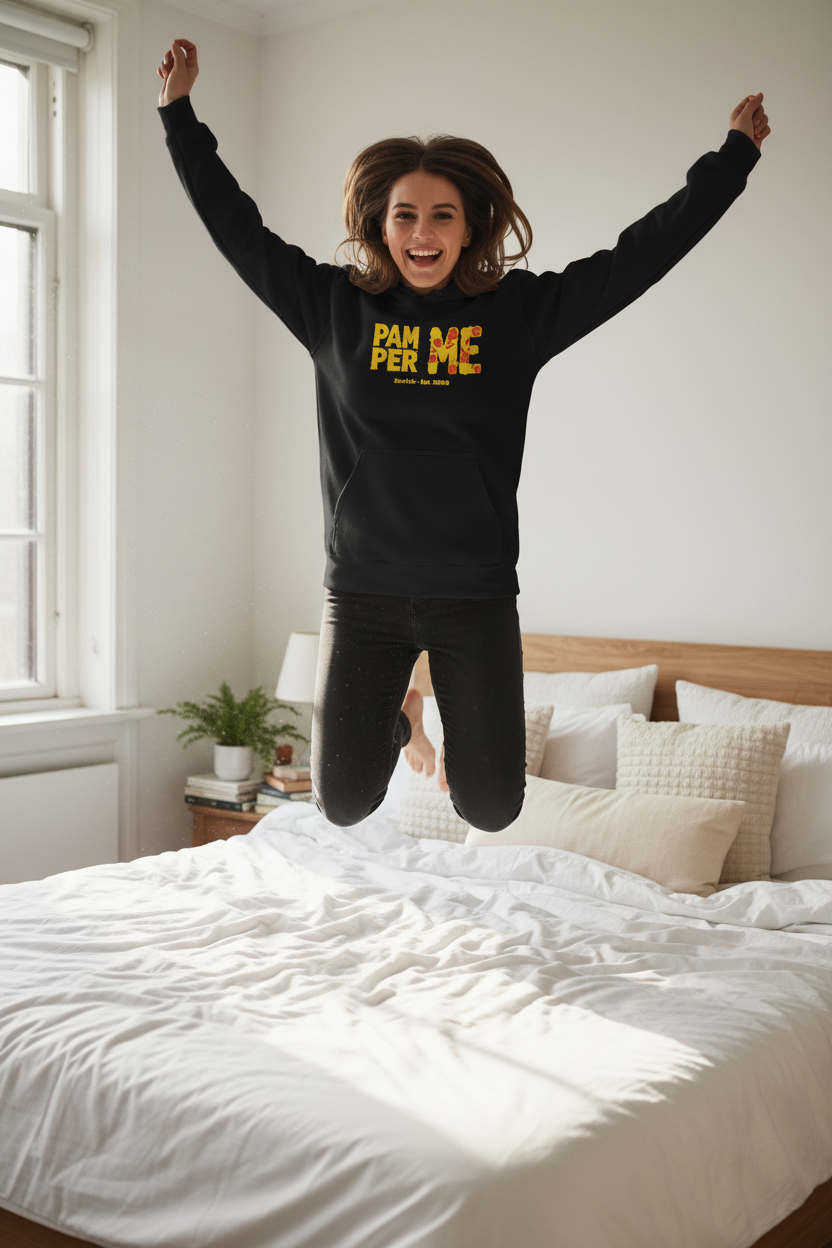 Person jumping on a bed wearing a black sweatshirt with yellow text