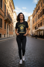 Woman walking down a street in an urban setting wearing a black t-shirt with yellow text and graphics.