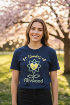 Woman wearing a blue t-shirt with '50 Shades of Alivwood' design in a park setting