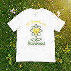 White t-shirt with '50 Shades of Flivwood' design on grass