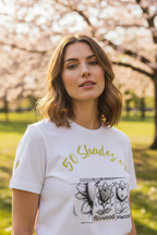 Woman wearing a white t-shirt with graphic design in a park with cherry blossoms